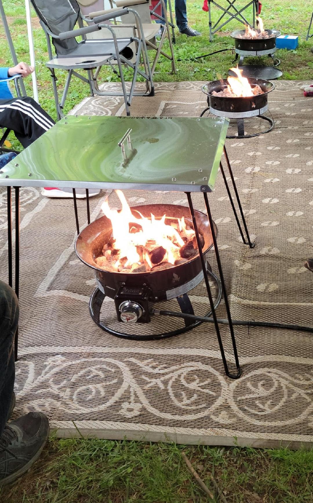 The New "MUST HAVE" for Camping. Heat Warden® USA QUALITY 24"x 24" Camping Square Heat Deflector with 24" Foldable Legs. (See menu above for Specs.)